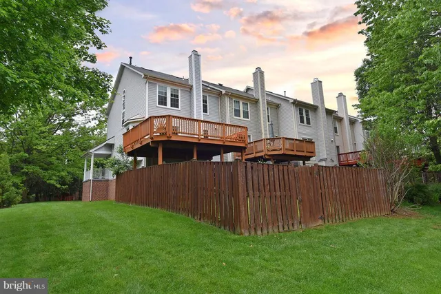 a porch with a table and chairs