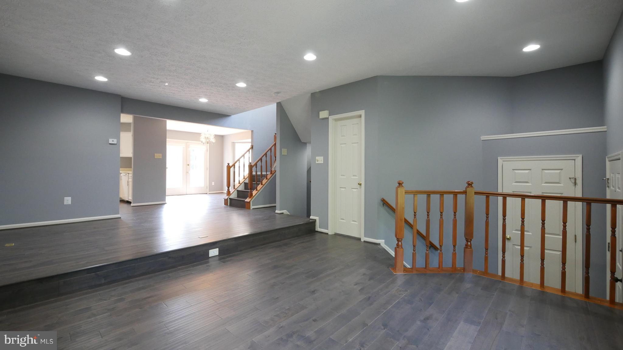 15 Beacon Hill Way Gaithersburg, MD 20878 - Photo 2 of 16 a view of a room with wooden floor