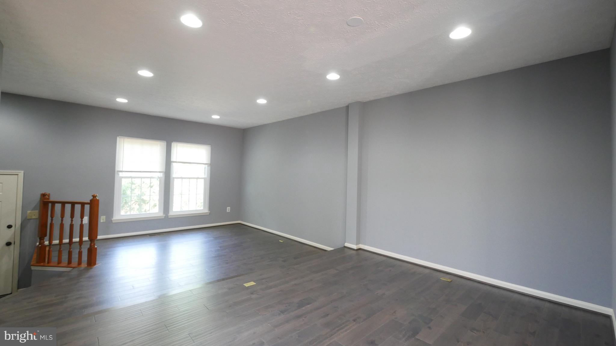15 Beacon Hill Way Gaithersburg, MD 20878 - Photo 16 of 16 an empty room with wooden floor and windows