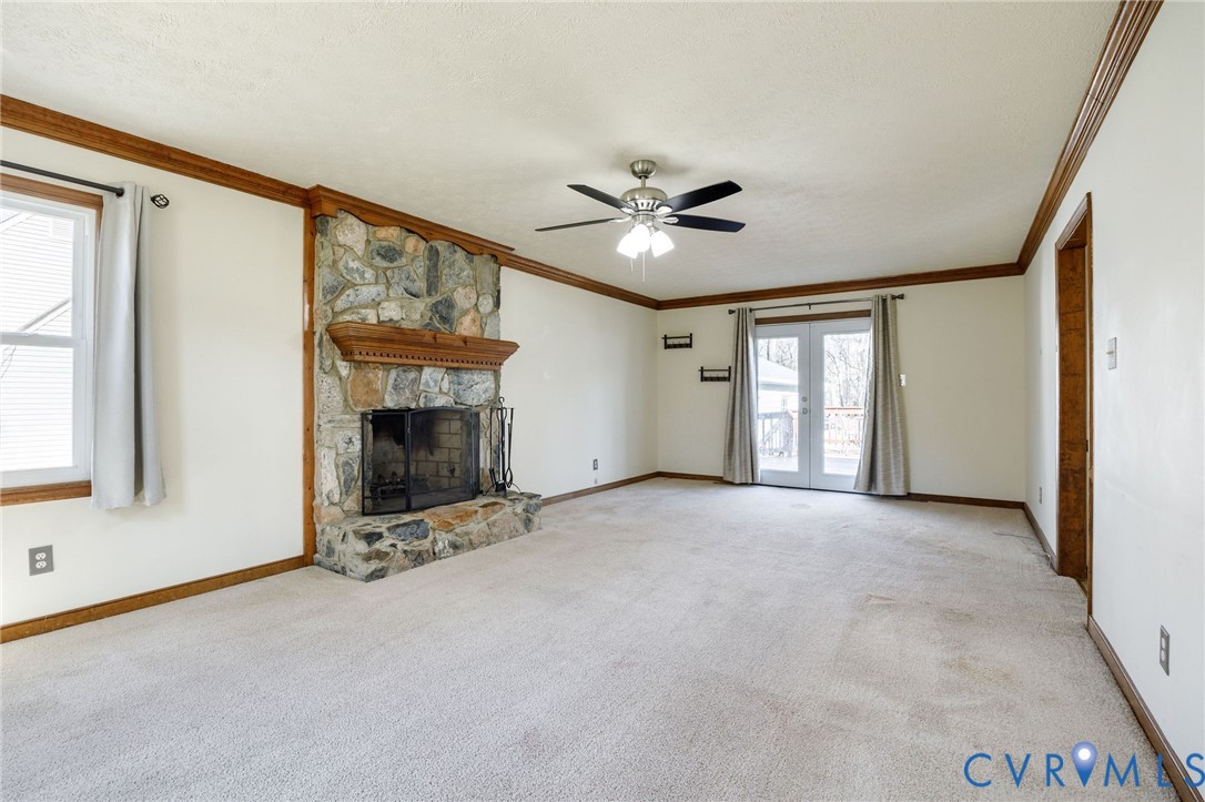 10400 Hamlin Drive Chester, VA 23831 - Photo 11 of 46 a view of a livingroom with a fireplace and a ceiling fan