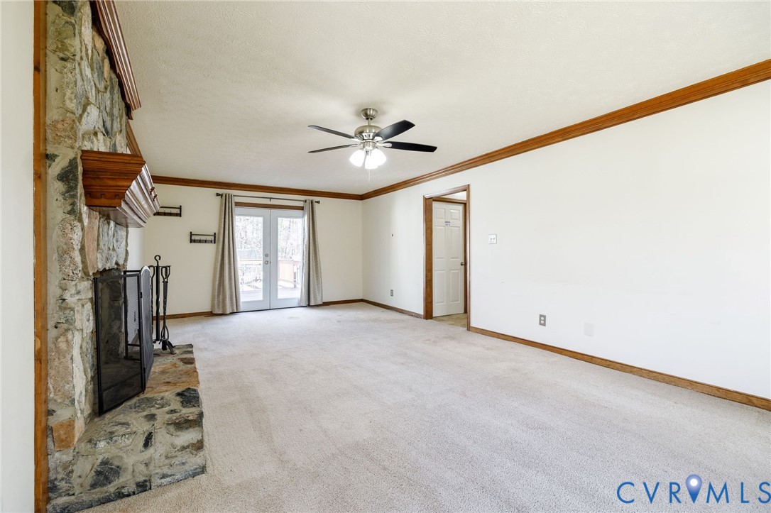 10400 Hamlin Drive Chester, VA 23831 - Photo 12 of 46 a view of a livingroom with a ceiling fan and window