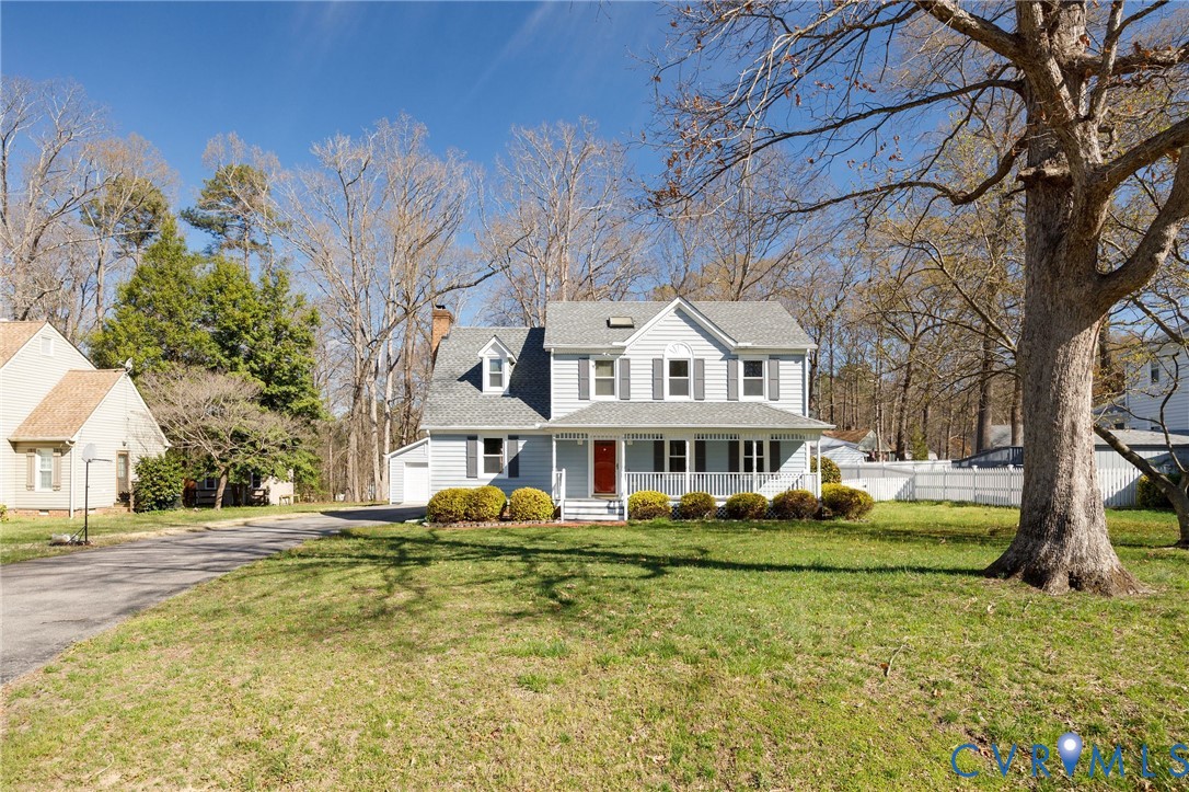 10400 Hamlin Drive Chester, VA 23831 - Photo 2 of 46 a front view of a building with a garden