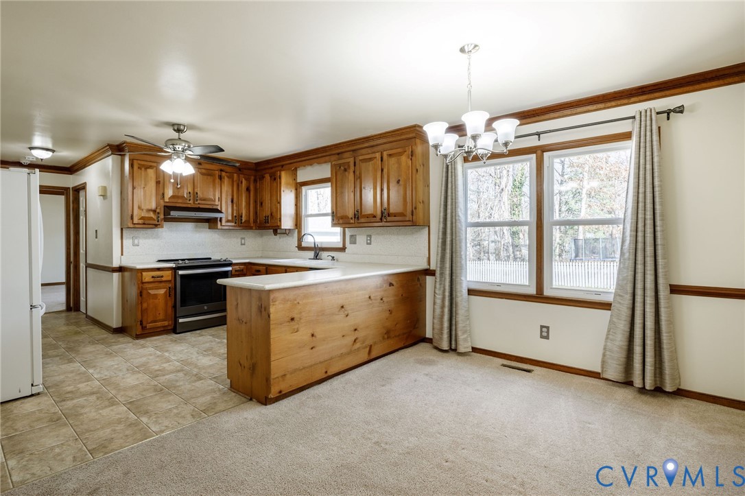 10400 Hamlin Drive Chester, VA 23831 - Photo 21 of 46 a kitchen with a refrigerator oven and a sink