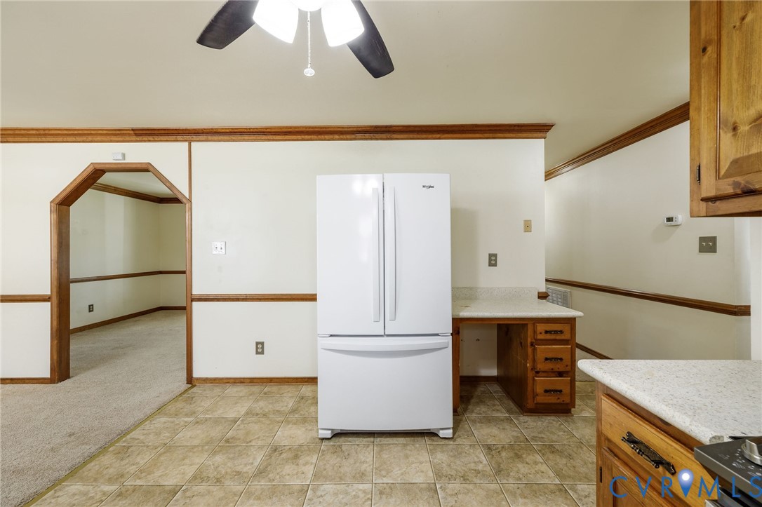 10400 Hamlin Drive Chester, VA 23831 - Photo 24 of 46 a kitchen with a refrigerator and cabinets
