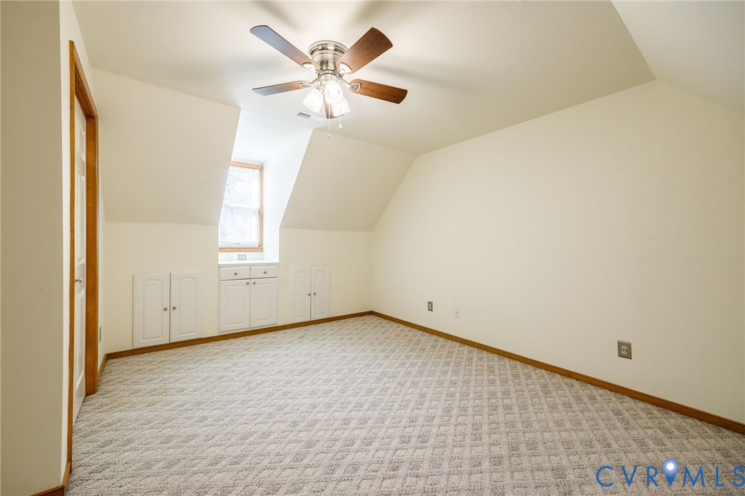 10400 Hamlin Drive Chester, VA 23831 - Photo 28 of 46 an empty room with windows and fan