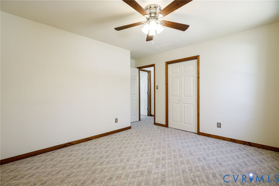 10400 Hamlin Drive Chester, VA 23831 - Photo 31 of 46 an empty room with chandelier fan
