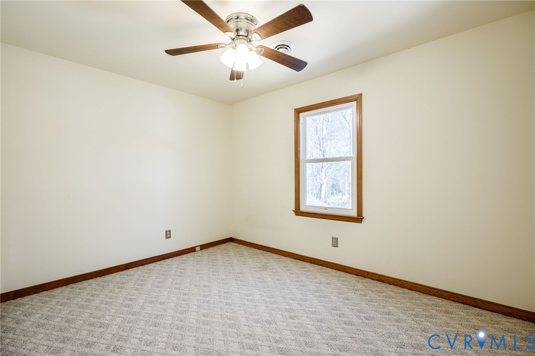 10400 Hamlin Drive Chester, VA 23831 - Photo 32 of 46 an empty room with a window and a fan