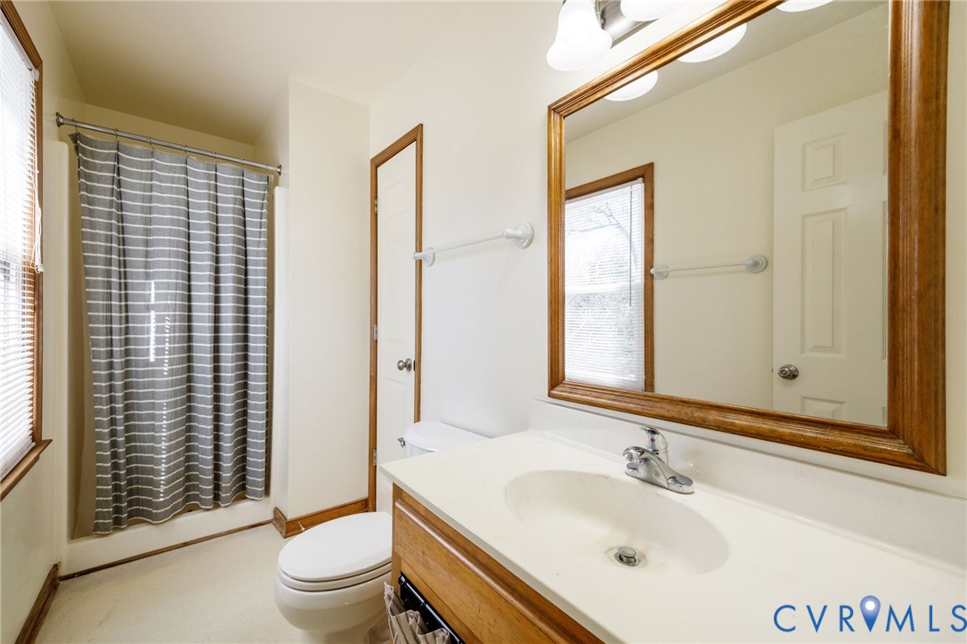 10400 Hamlin Drive Chester, VA 23831 - Photo 34 of 46 a bathroom with a sink a toilet and shower