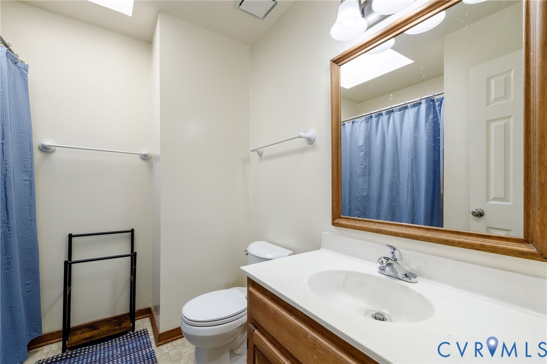 10400 Hamlin Drive Chester, VA 23831 - Photo 35 of 46 a bathroom with a sink toilet and a mirror