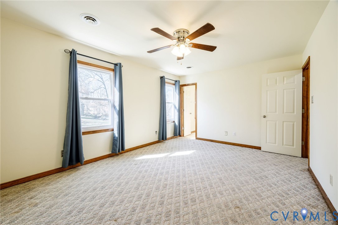 10400 Hamlin Drive Chester, VA 23831 - Photo 36 of 46 an empty room with windows and fan