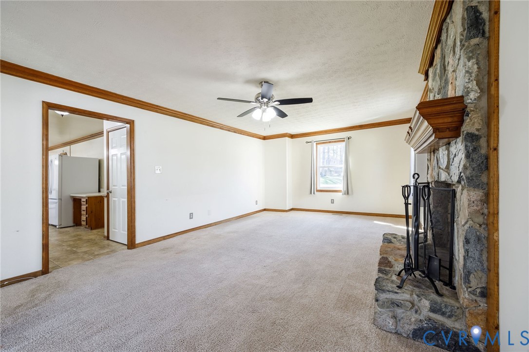 10400 Hamlin Drive Chester, VA 23831 - Photo 10 of 46 a view of a livingroom with a ceiling fan and window