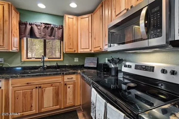 a living room with furniture a large window with outer view