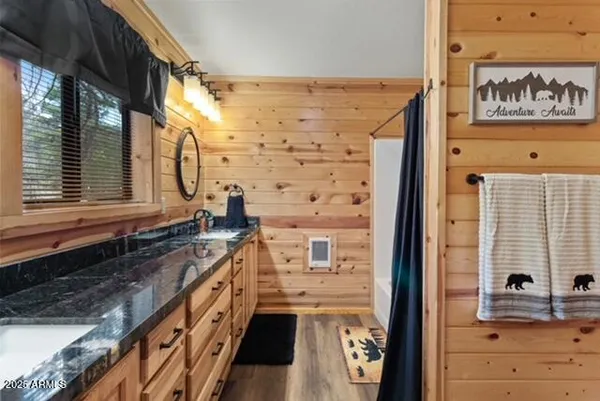 a kitchen with stainless steel appliances granite countertop a sink stove and microwave
