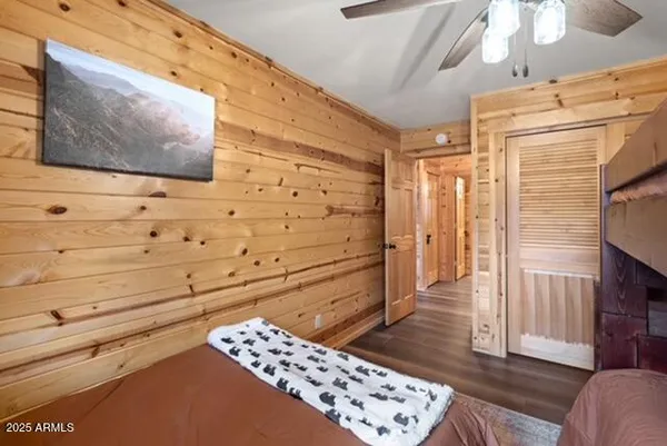 a bathroom with a granite countertop sink and a shower