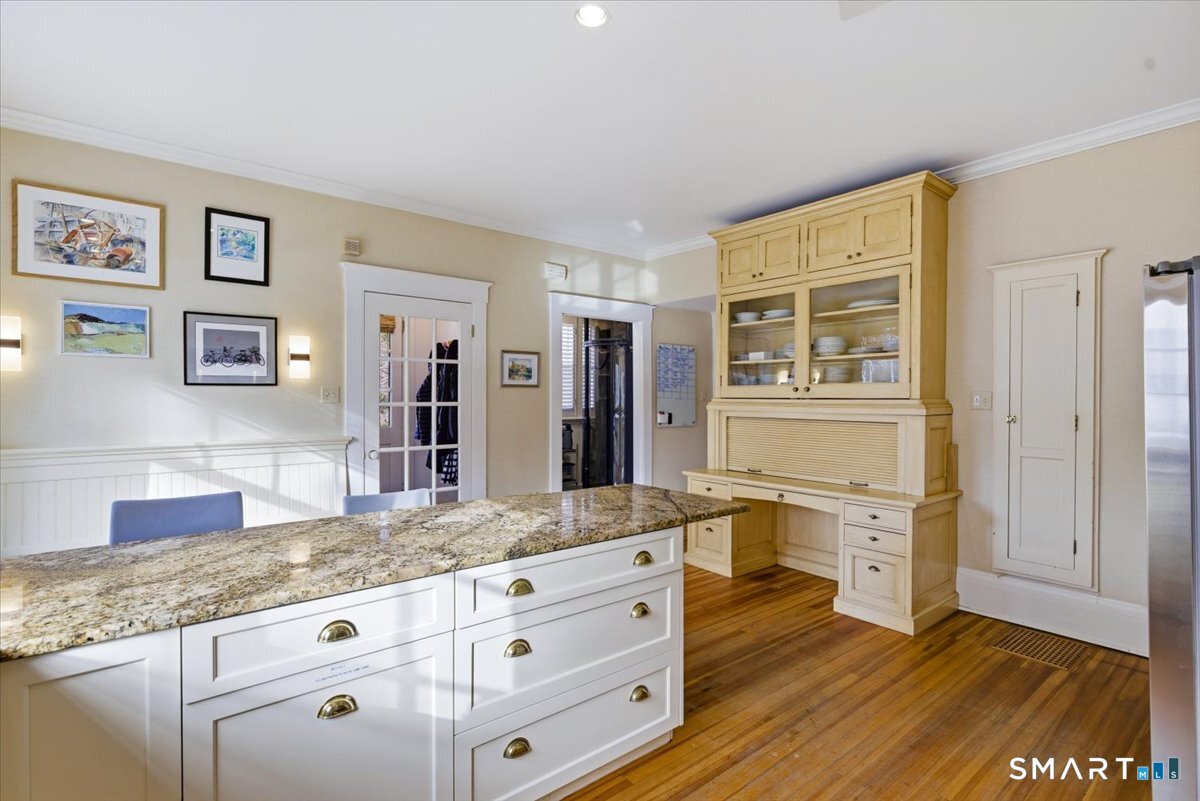 144 Edgehill Road Hamden, CT 06517 - Photo 17 of 42 a spacious bathroom with a granite countertop sink and a mirror