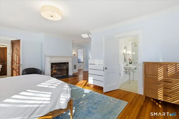 a bedroom with a bed and a table