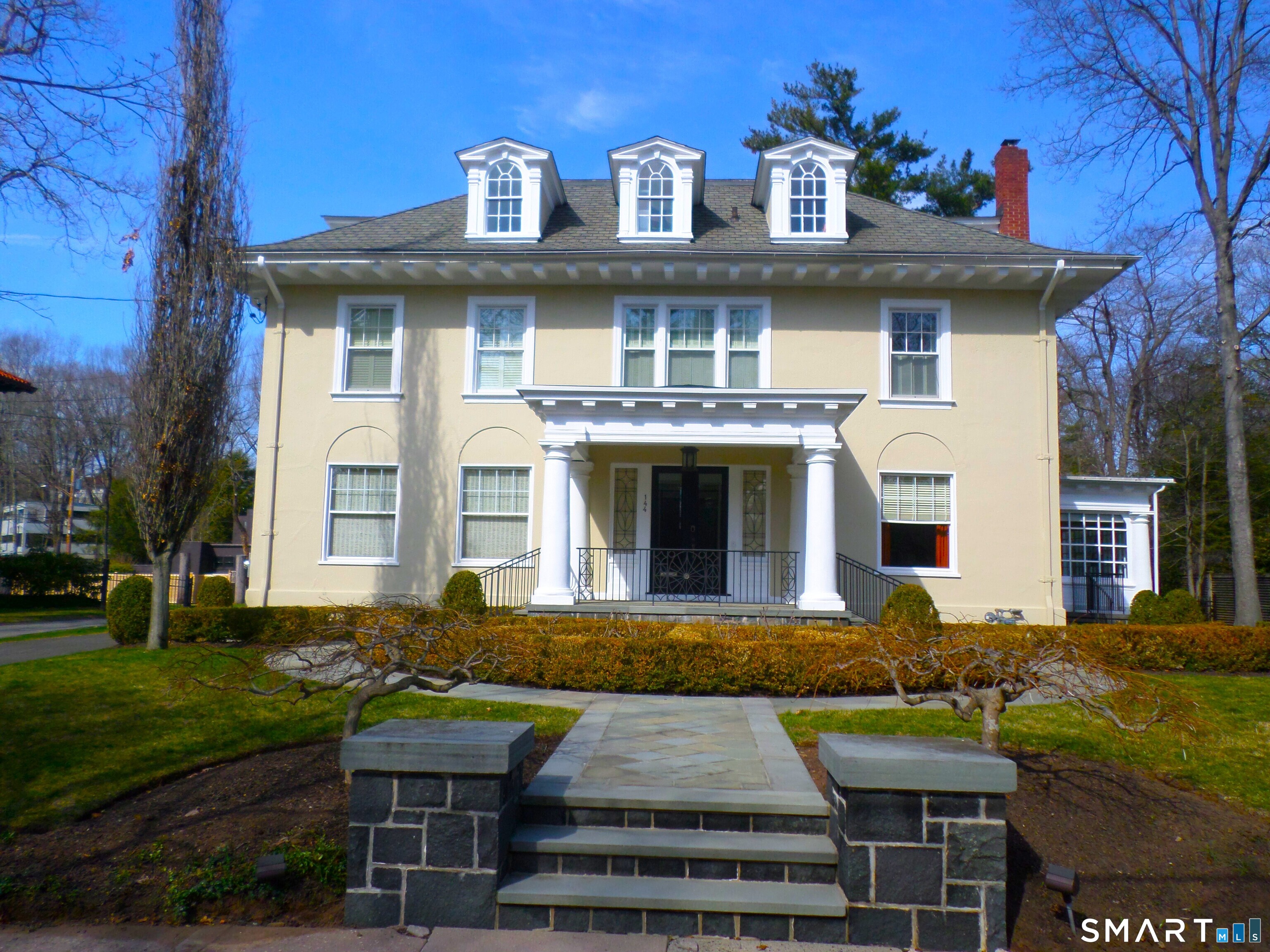 144 Edgehill Road Hamden, CT 06517 - Photo 2 of 42 a front view of a house with garden