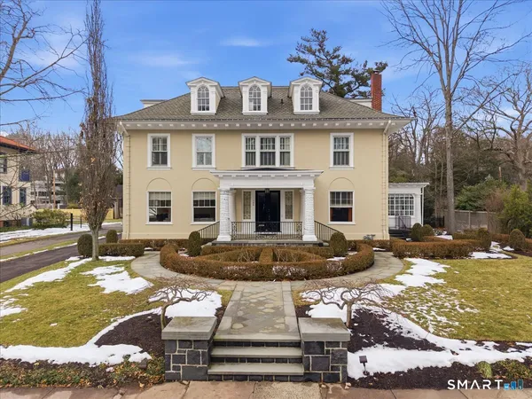 a front view of a house with a yard
