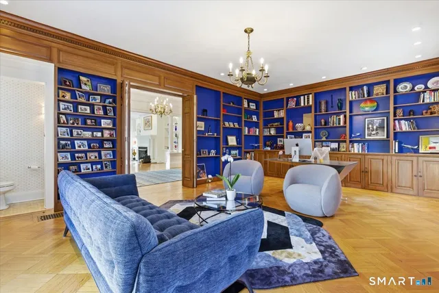 a spacious bathroom with a granite countertop sink and a mirror