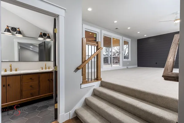 a en suite bathroom with a toilet sink and mirror