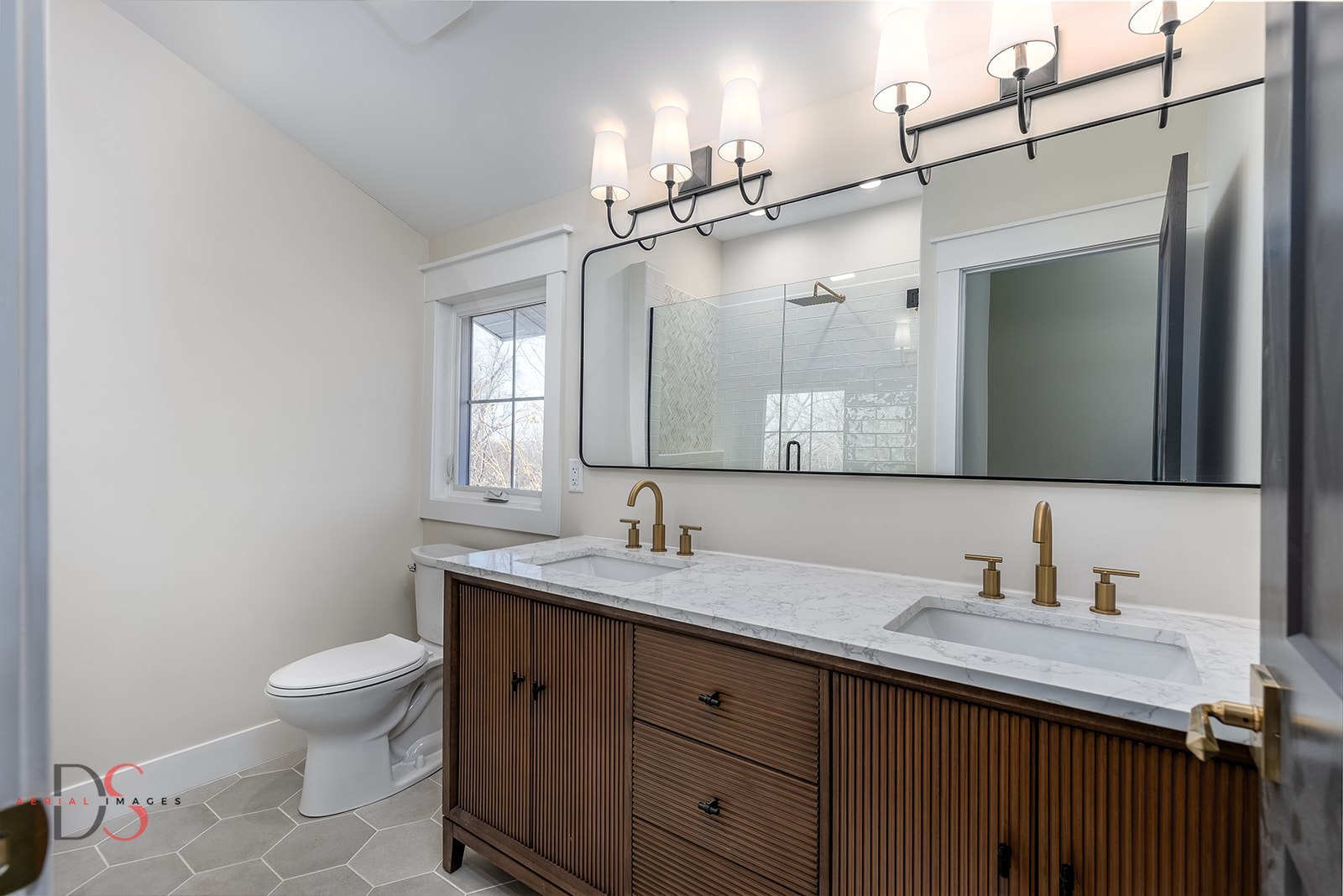 400 Park Avenue Ottawa, IL 61350 - Photo 27 of 31 a bathroom with a granite countertop sink toilet a mirror and shower