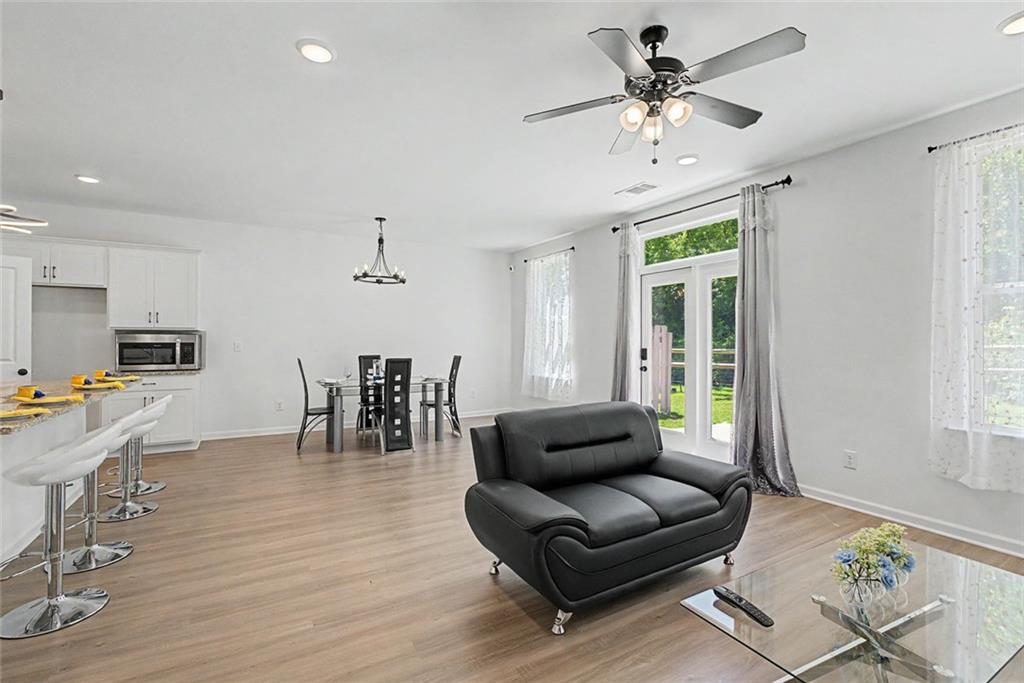 2310 Portrush Way Southeast Atlanta, GA 30339 - Photo 17 of 38 a living room with furniture and a large window