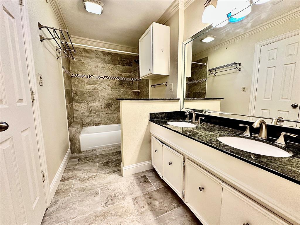 6632 Winding Rose Trail Dallas, TX 75252 - Photo 18 of 23 a bathroom with a granite countertop sink and a mirror