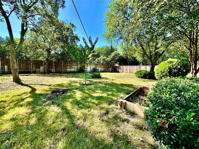 a swimming pool with wooden fence