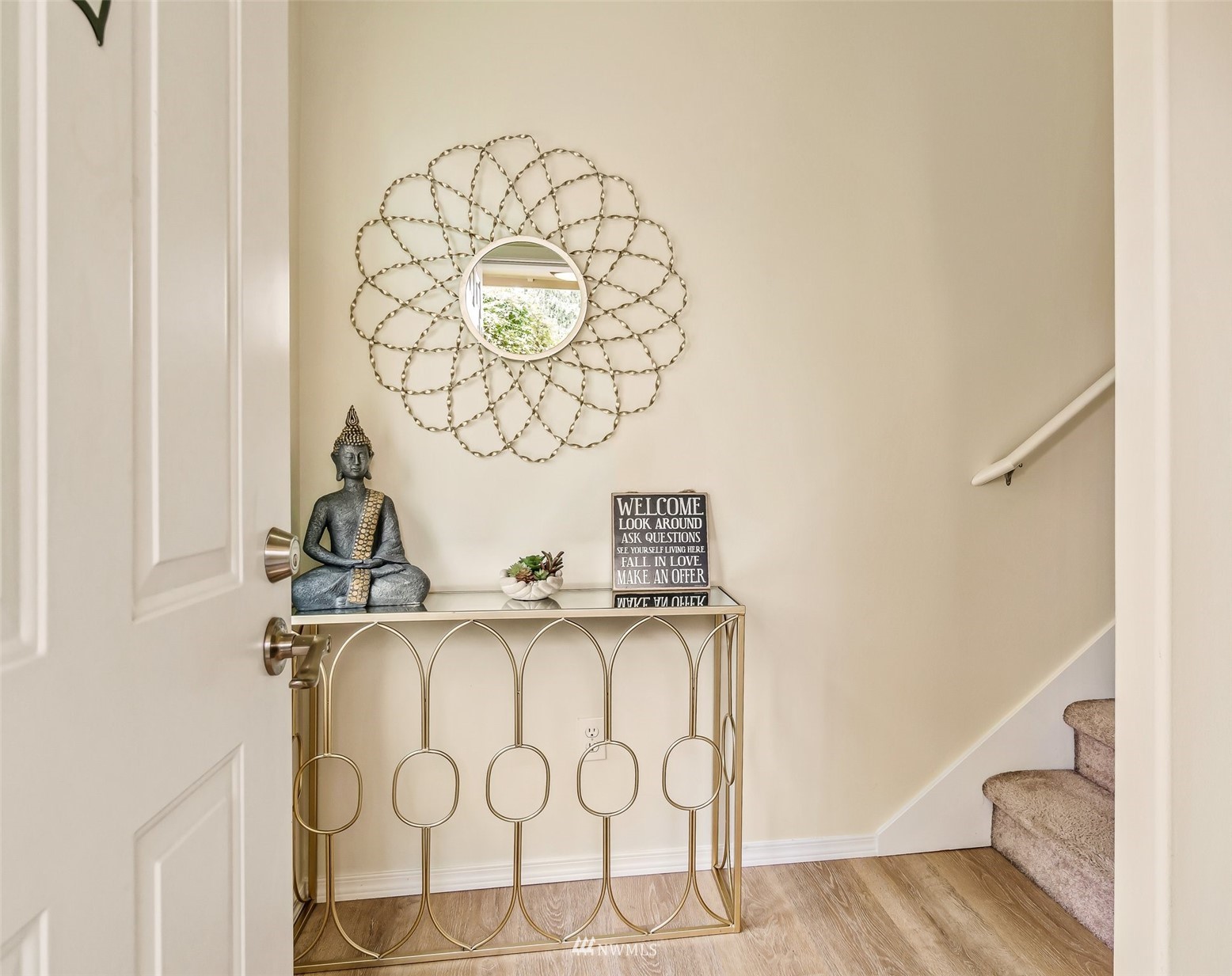 15 164th Street Southwest, Unit D1 Bothell, WA 98012 - Photo 4 of 40 a view of a hallway with wooden floor and a chandelier