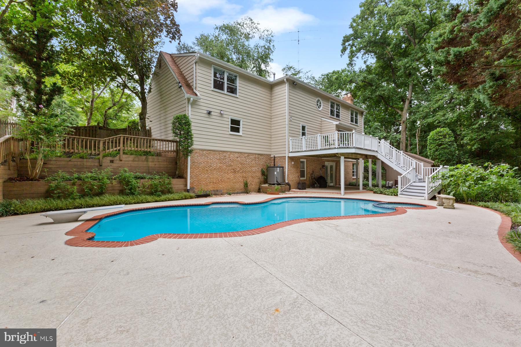 14504 Cutstone Way Silver Spring, MD 20905 - Photo 44 of 52 Large patio area around pool and under deck