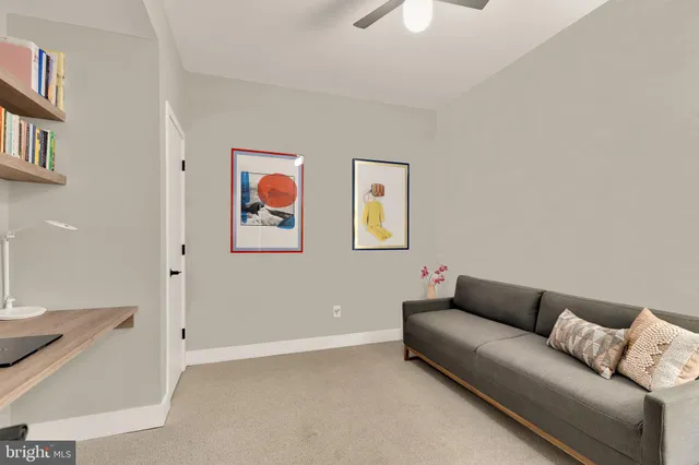 a bedroom with a bed and a lamp