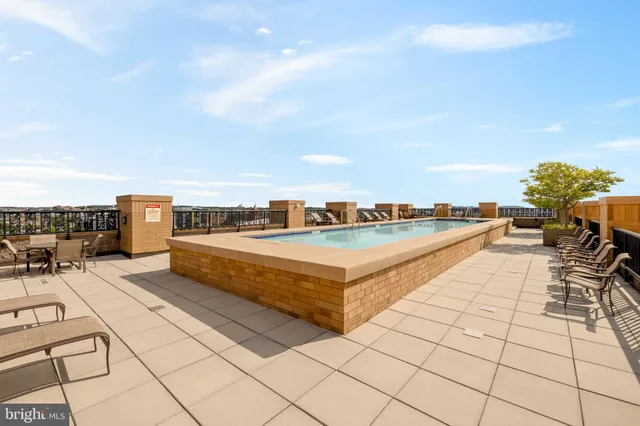 a view of a terrace with couches and potted plants