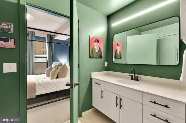 a en suite bathroom with a sink and a mirror