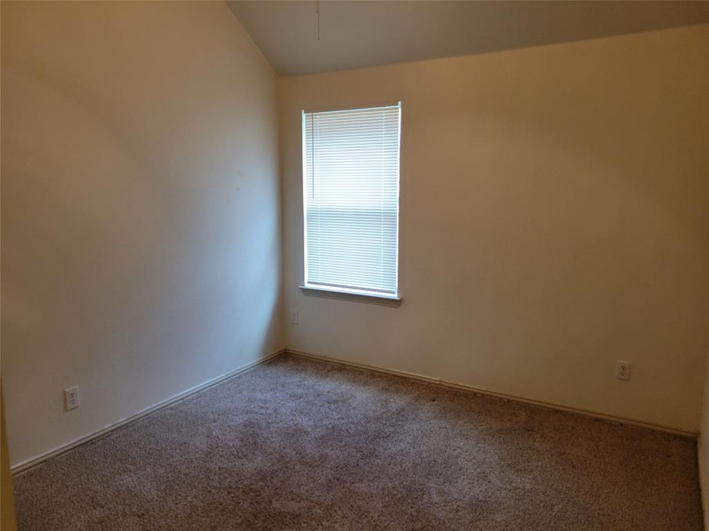 508 Hummingbird Drive Little Elm, TX 75068 - Photo 12 of 14 an empty room with a window