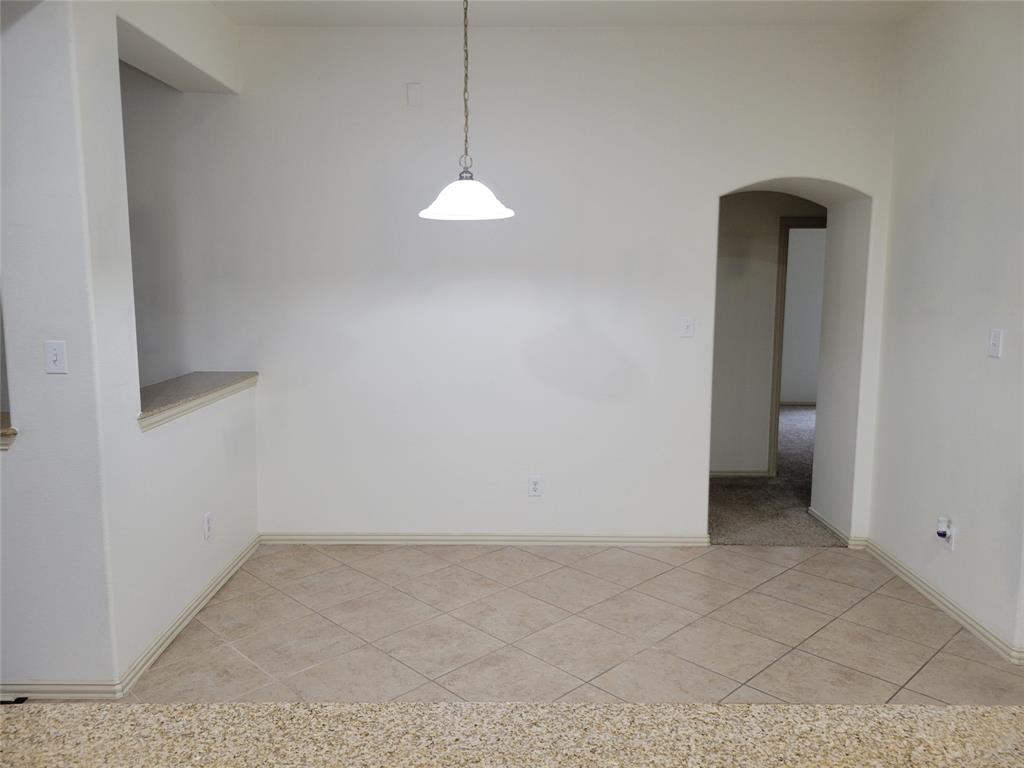 508 Hummingbird Drive Little Elm, TX 75068 - Photo 5 of 14 wooden floor in an empty room with a window