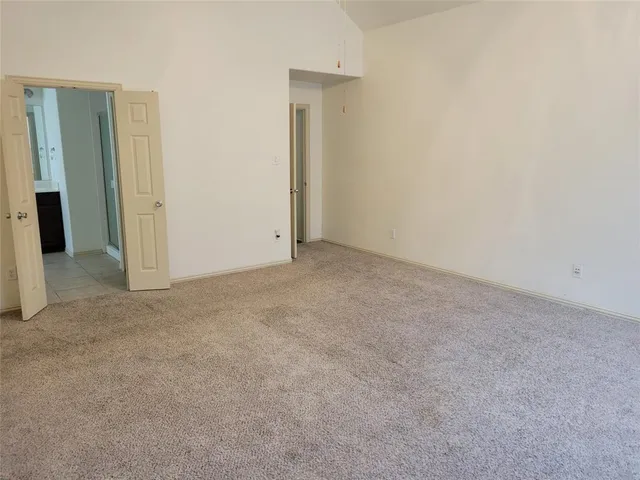 an empty room with closet area