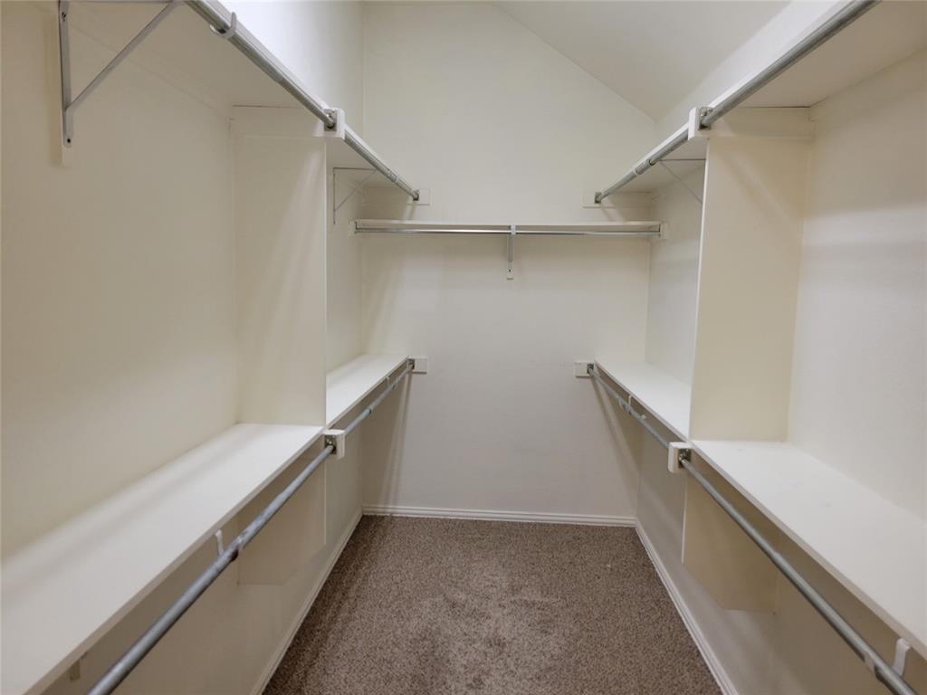 508 Hummingbird Drive Little Elm, TX 75068 - Photo 8 of 14 a view of an empty walk in closet
