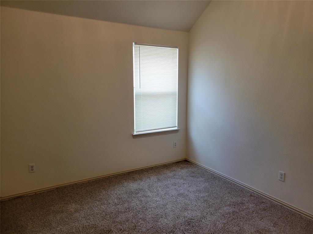 508 Hummingbird Drive Little Elm, TX 75068 - Photo 10 of 14 an empty room with a window