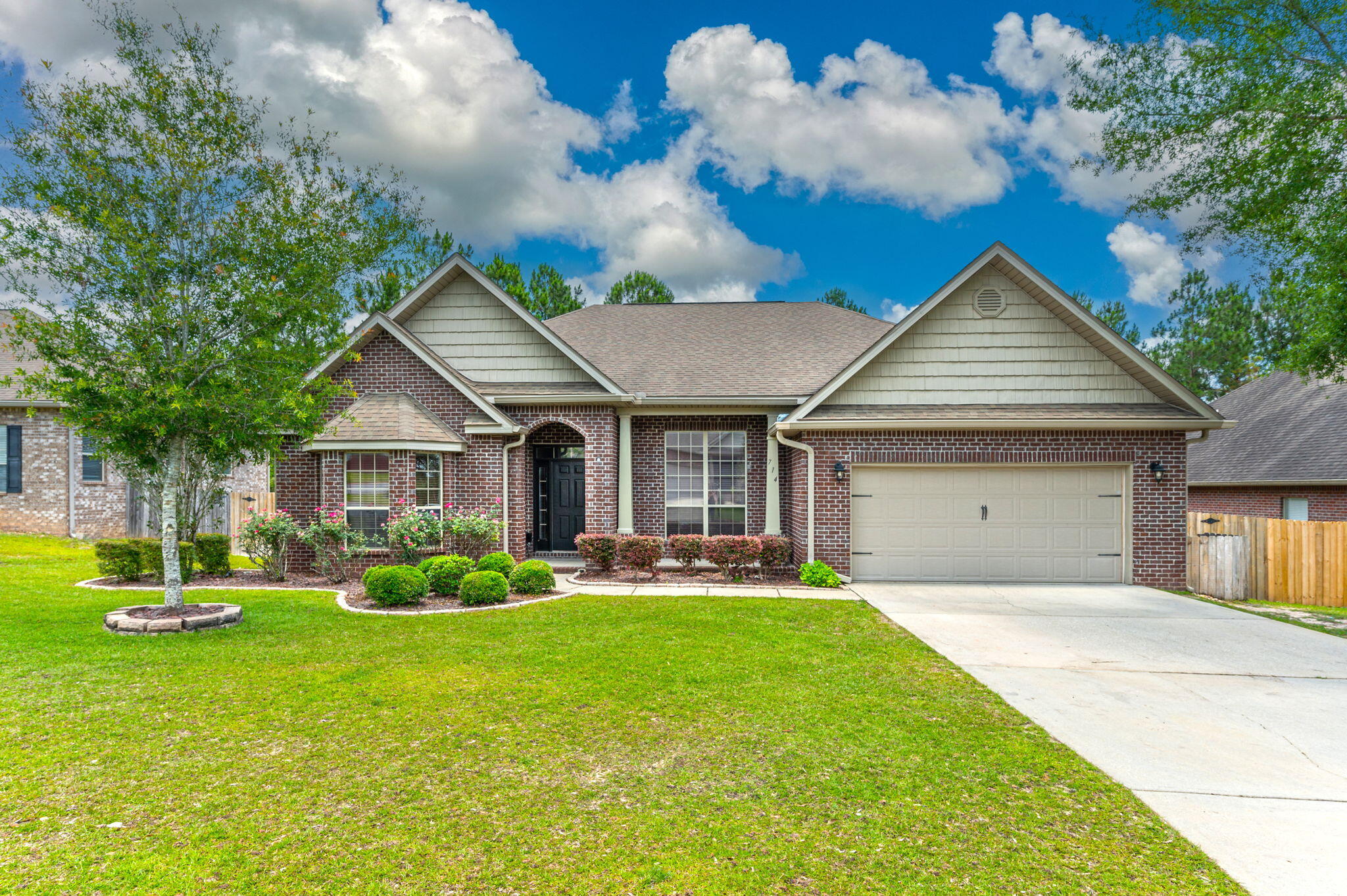 714 Lime Lane Crestview, FL 32536 - Photo 1 of 47 a front view of a house with a yard and porch