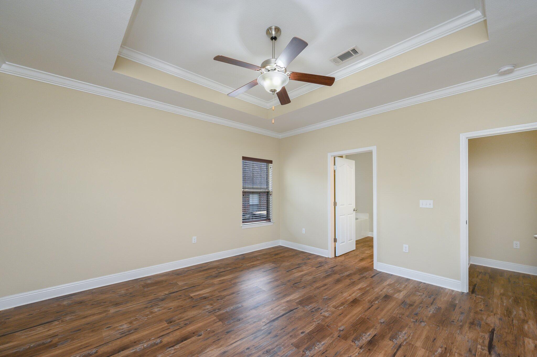 714 Lime Lane Crestview, FL 32536 - Photo 22 of 47 a view of an empty room with wooden floor