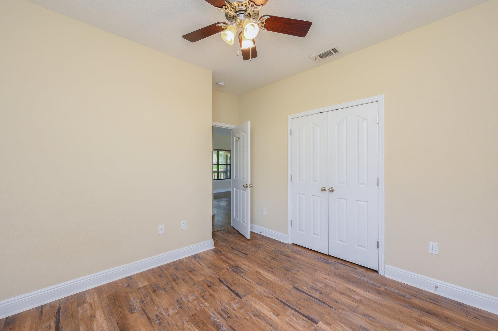 714 Lime Lane Crestview, FL 32536 - Photo 28 of 47 wooden floor in an empty room with a window