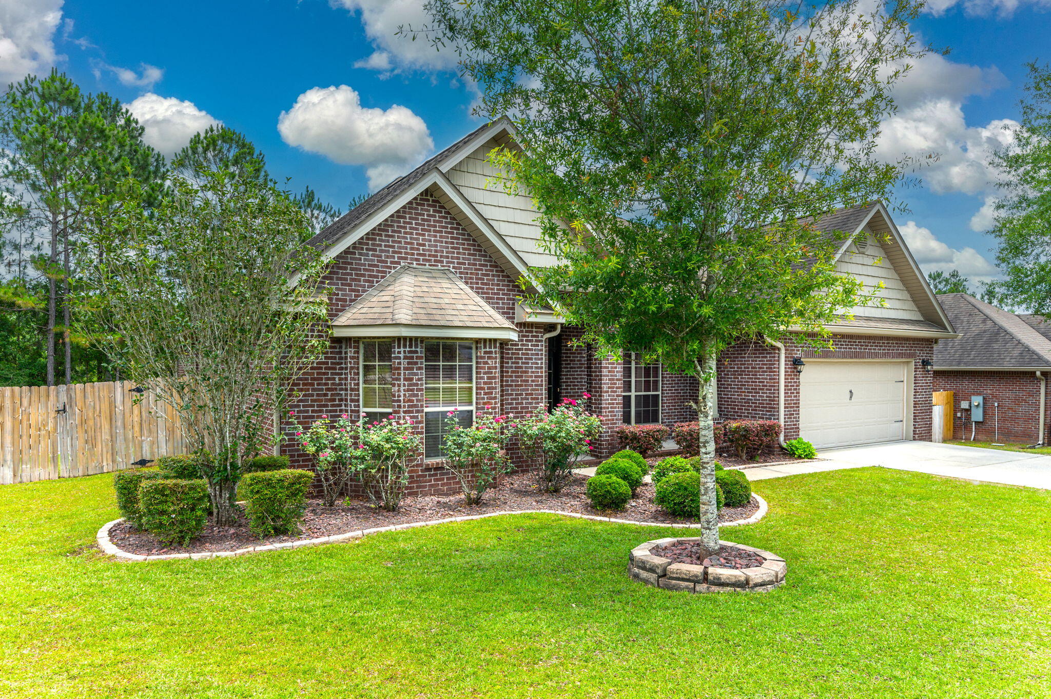 714 Lime Lane Crestview, FL 32536 - Photo 3 of 47 a front view of house with a garden and swimming pool