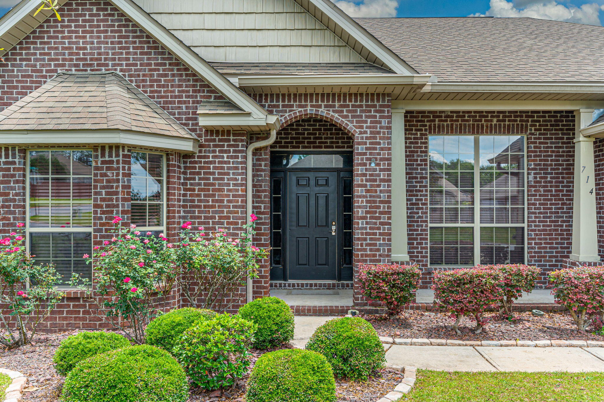 714 Lime Lane Crestview, FL 32536 - Photo 4 of 47 a front view of a house with garden