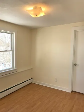 an empty room with a empty space and window