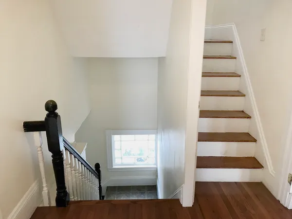 a view of entryway with wooden floor