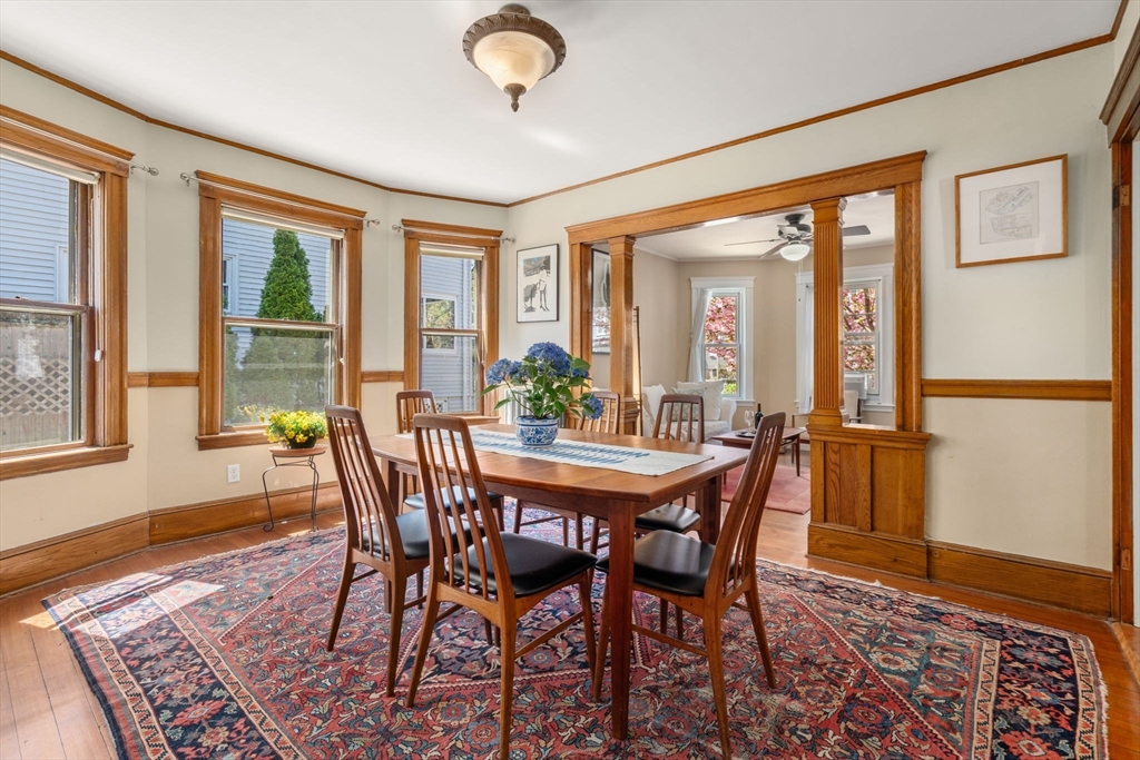 45 Springfield Street, Unit 1 Belmont, MA 02478 - Photo 9 of 27 a view of a dining room with furniture wooden floor and a rug