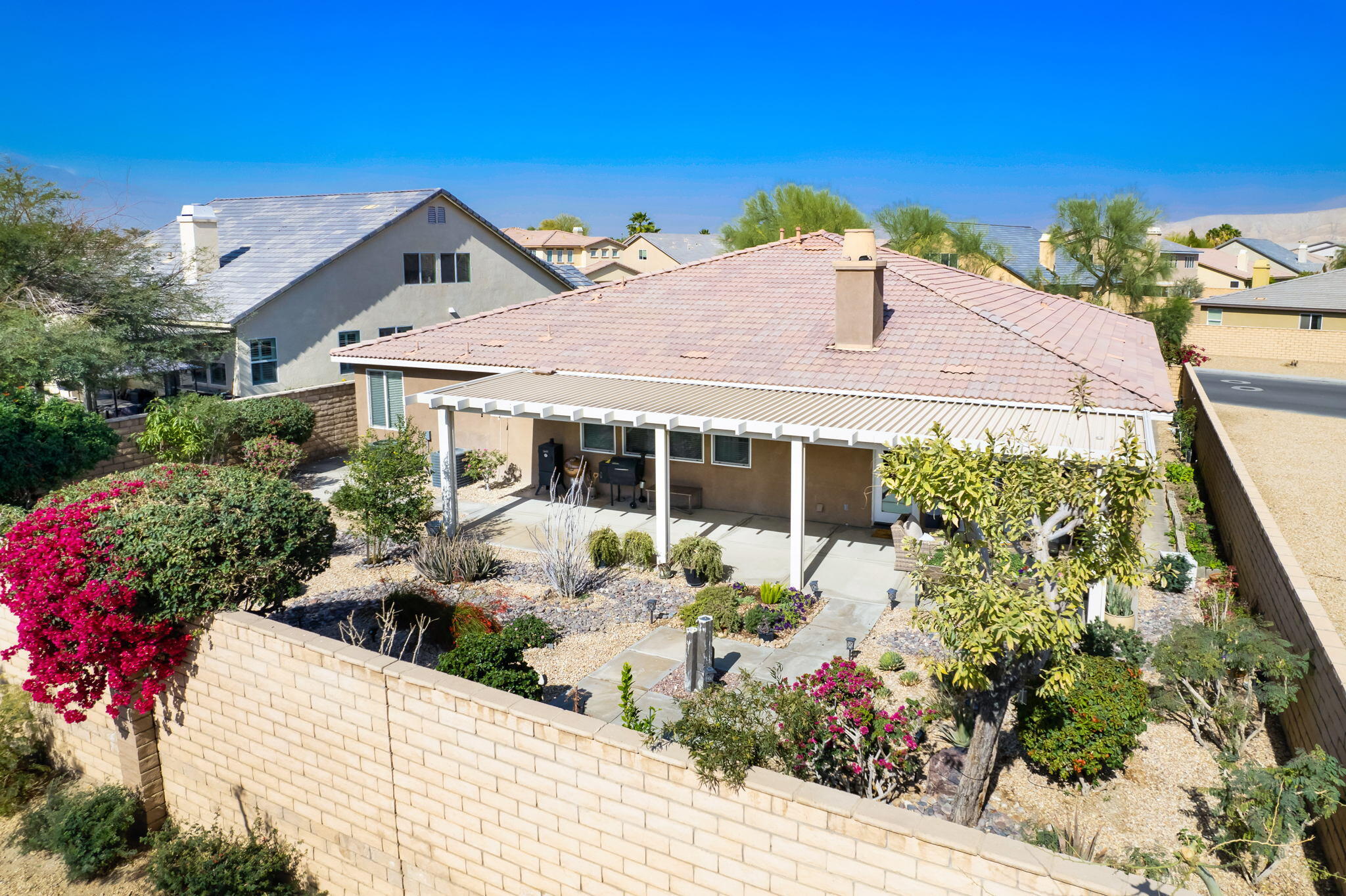 80219 Maramar Drive Indio, CA 92203 - Photo 39 of 41 a front view of a house with a yard