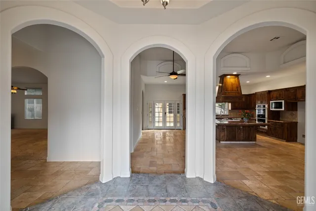 a kitchen with a stove a sink and a cabinets