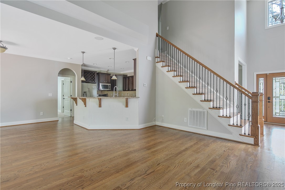 716 Micahs Way North Spring Lake, NC 28390 - Photo 12 of 50 a view of a kitchen with wooden floor and electronic appliances