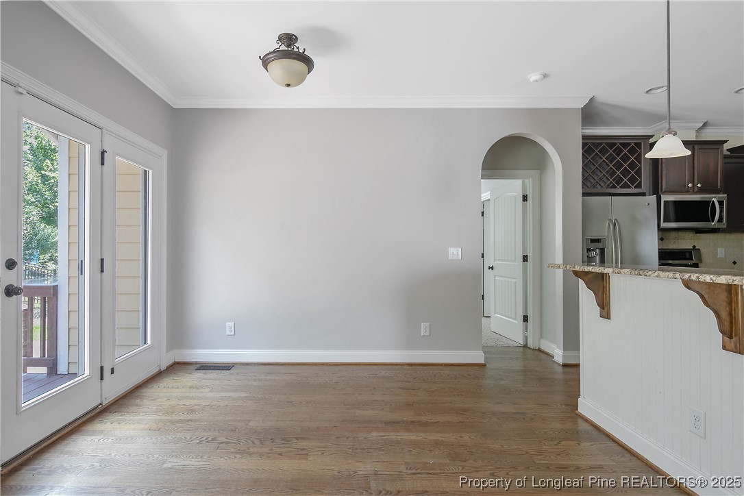 716 Micahs Way North Spring Lake, NC 28390 - Photo 15 of 50 a view of empty room with cabinet and window